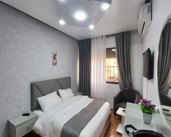 Al-Nujoom Hotel Suites - Ammán - Habitación