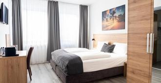 Livinn Hotel - Dortmund - Yatak Odası