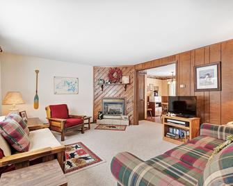 Rustic & convenient mountain condo w/ gas fireplace & lake views - Eagle River - Living room