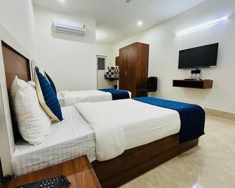 The Umra Hotel - גורגאון - חדר שינה