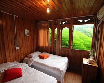 Dragon's Den Hostel in Rice Terraces - גילין - חדר שינה