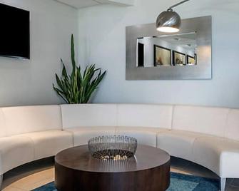 Enjoy the salty air and sea breezes from your oceanfront balcony. - Daytona Beach Shores - Living room