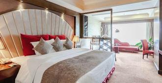 Rezen Hotel Urumqi Oriental Dynasty - Ürümqi - Bedroom