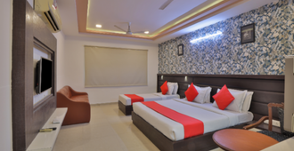 Hotel Sadbhav - 艾哈邁達巴德 - 臥室