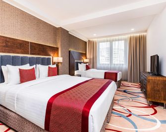 Ramada Hotel & Suites by Wyndham Yerevan - Eriwan - Schlafzimmer
