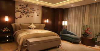 Howard Johnson by Wyndham Xiangyu Plaza Linyi - Linyi - Bedroom
