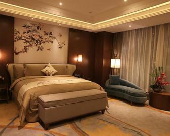Howard Johnson by Wyndham Xiangyu Plaza Linyi - Linyi - Camera da letto