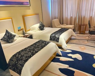 Hailong Hotel (Pangdonglai Life Plaza) - Xuchang - Bedroom