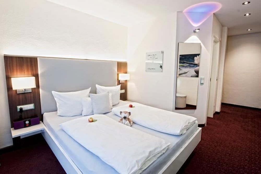 Hotel Jungstil - דארמשטאט - חדר שינה