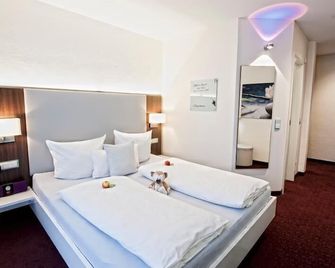 Hotel Jungstil - דארמשטאט - חדר שינה