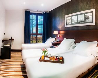 Hotel Granda - קאנגאס דה אוניס - חדר שינה