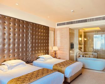 Ganzhou Yihao Hotel (Nanmenkou Yugutai Branch) - Ganzhou - Bedroom
