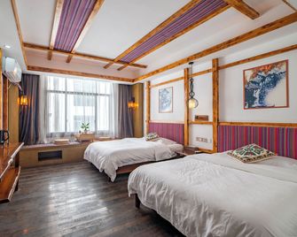 Zhangjiajie Nanfang Yinan Hostel - ג'אנגג'יאיי - חדר שינה