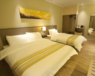Home Inn Plus Rizhao Jinan Road International Financial Center Ocean Park - Rizhao - Bedroom
