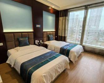 Jinwan Hotel - Taiyuan - Schlafzimmer
