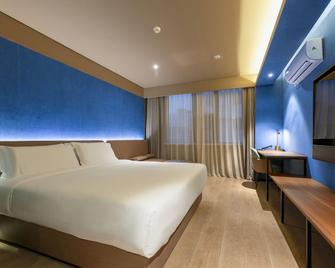 Orange Hotel Ningbo Railway Station - Ningbo - Bedroom
