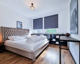 Alpha Apartments: Maritimer Stil, Entspannungsoase - Essen - Bedroom