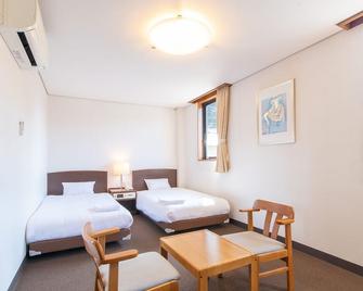 Tabist Business Hotel Fujiya - Hirado - Camera da letto