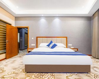 Wenzheng Grand Hotel (Zunyi Haier Avenue) - Zunyi - Bedroom