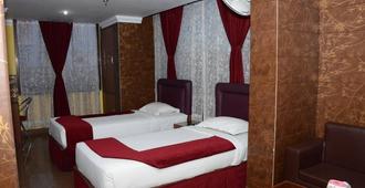 Hotel Raj Palace - Calcutta - Slaapkamer