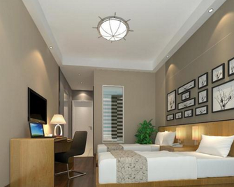 7 Days Inn Rui Chang Pen Cheng East Road Branch - Jiujiang - Sypialnia