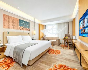 Mans Junlan International Hotel - Ganzhou - Schlafzimmer