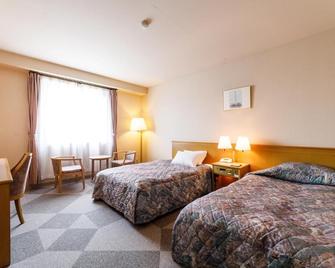 Fukuno Town Hotel Amieux - Nanto - Schlafzimmer