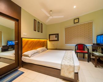 Hotel Dolphin Puri - Puri - Bedroom