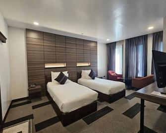 Family Boutique Hotel - ויינטיאן - חדר שינה