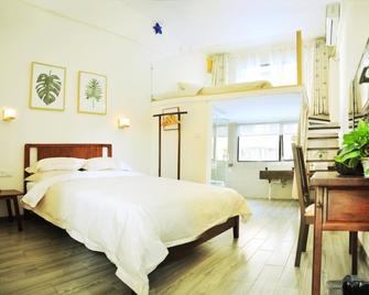 Qingcheng Inn - Guilin - Schlafzimmer
