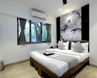 Chembur Homeotel - Gagal Home - 孟買 - 臥室