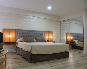 Howard Johnson by Wyndham Rosario - Rosario - Habitación