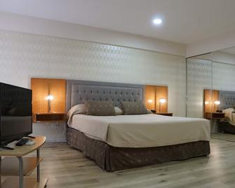 هاورد جونسون من ويندام روساريو - روزاريو - غرفة نوم