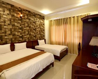 Nhat Minh Hotel - Lagi - Habitación