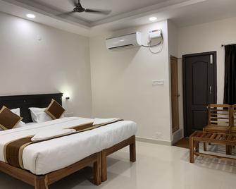 Qube Inn - Hyderabad - Bedroom