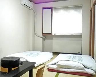 Ryokan Sangetsu - Mishima - Schlafzimmer