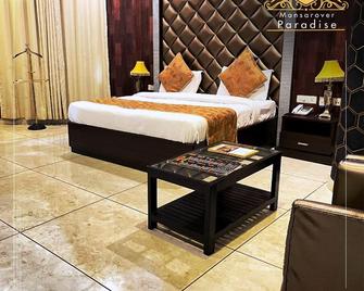Mansarover Paradise Hotel - Morādābād - Bedroom
