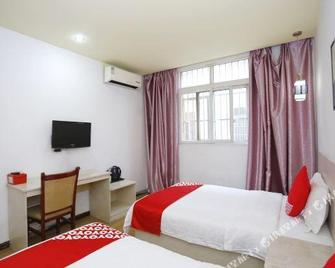 OYO Tongxing Business Hotel - Enshi - Habitación