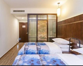 Huanghua Yiguan Hotel - Yangzhou - Schlafzimmer