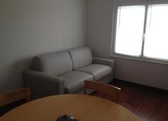 Apartment on the ground floor of the owners house - Granville - Living room