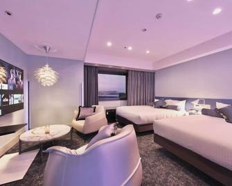 Deluxe Twin Room Nonsmoking 30 square meters R / Suita Ōsaka - Suita - Slaapkamer