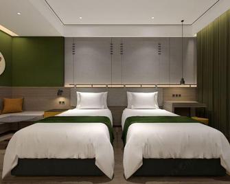 Zhouchun Hotel - Zibo - Habitación