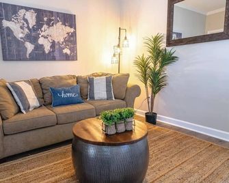 Sleep well in a quiet Cottage Hill retreat just a six-block walk from downtown, with a king bed, dedicated parking, and a stay guests return to again and again. - Montgomery - Living room