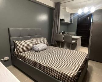 Cozy studio condo with WiFi, AC, washer in delightful Lapu-Lapu City - Lapu-Lapu City - Bedroom