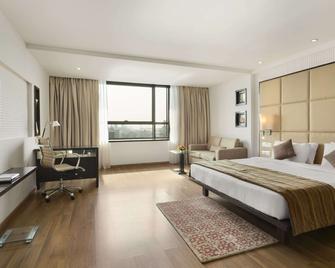Ramada by Wyndham Navi Mumbai - נבי מומבאי - חדר שינה