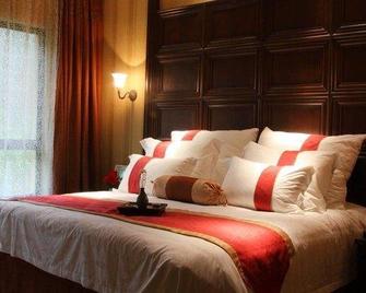 Qingshuiwan Hot Spring Holiday Village - Jinhua - Schlafzimmer