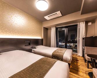 Apa Hotel Shin Osaka Eki Tower - Osaka - Bedroom