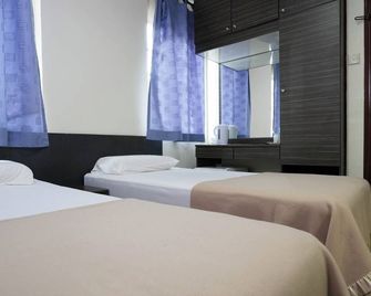 Amrise Hotel - Singapore - חדר שינה