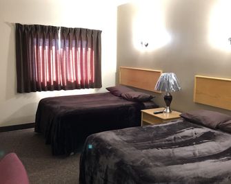 Nights Inn Motel - ת'אנדר ביי - חדר שינה