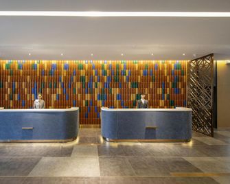 Orange Hotel Tianjin Jinnan University Town New International Exhibition Center - Tianjin - Receptionist